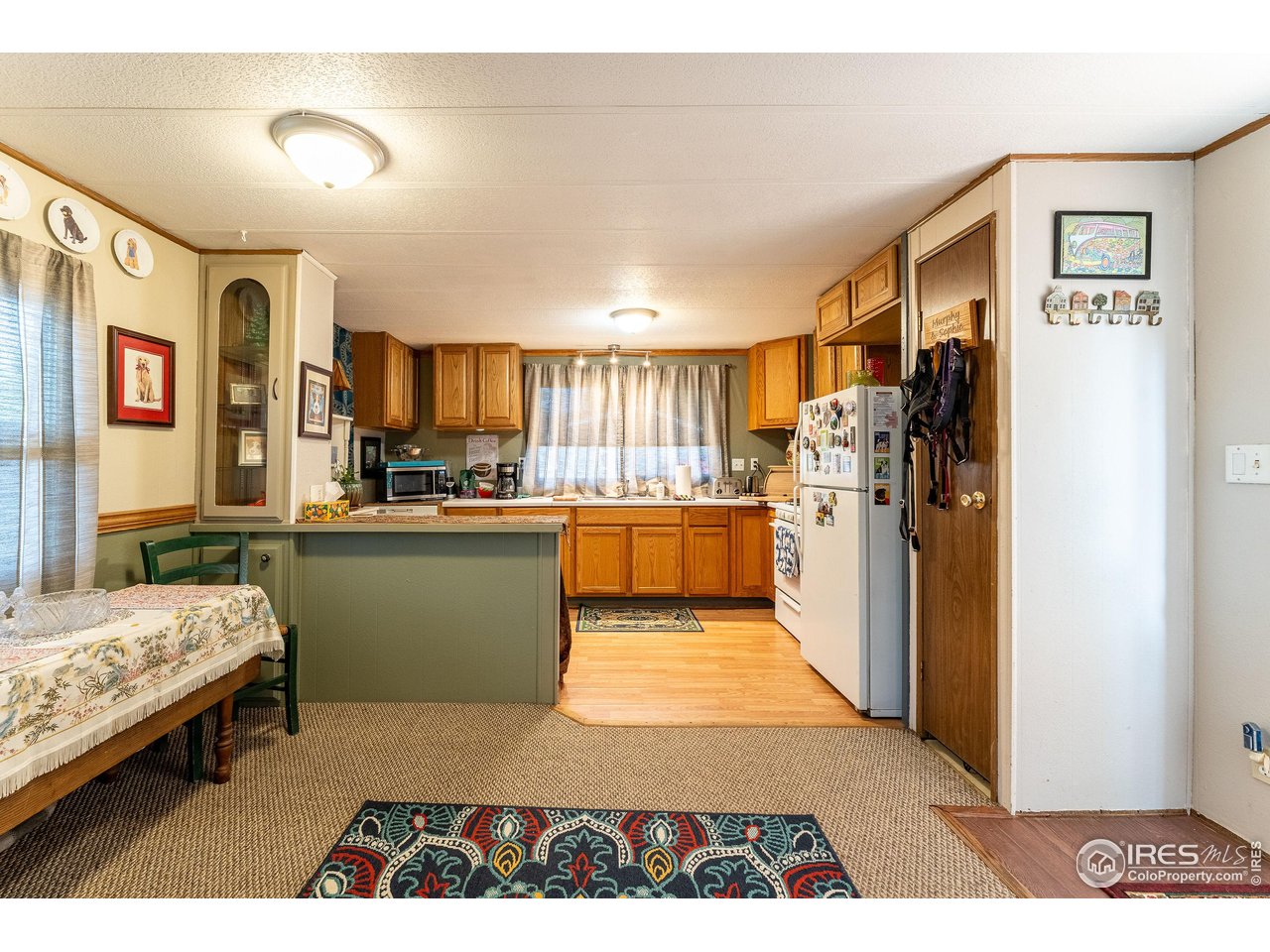 2500 East Harmony Road, Unit 456 Fort Collins, CO 80528 - Photo 5 of 22 a kitchen with stainless steel appliances granite countertop a refrigerator and a stove
