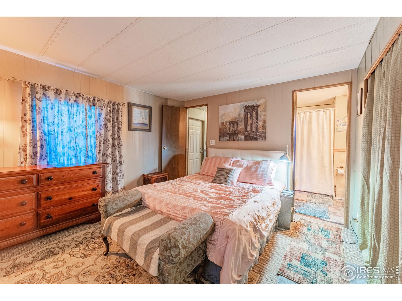 2500 East Harmony Road, Unit 456 Fort Collins, CO 80528 - Photo 10 of 22 a bedroom with a bed and a window
