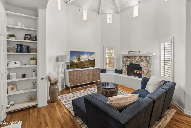 a living room with furniture and a fireplace