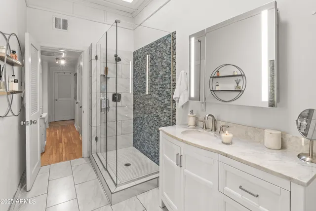 a view of bathroom with a toilet sink and a mirror