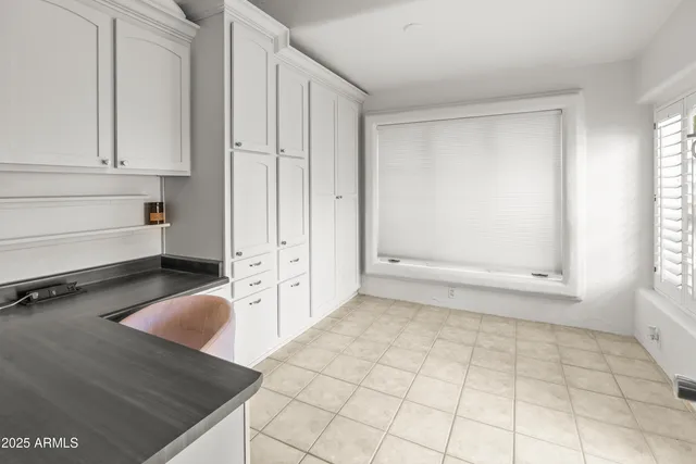 a view of a workspace with furniture