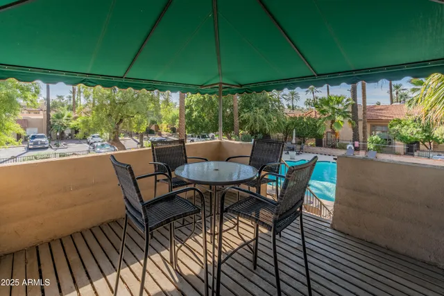 a view of a backyard with swimming pool