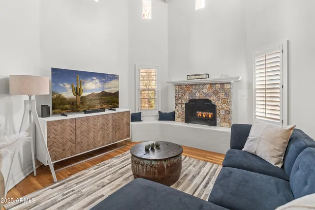 a view of a patio with table and chairs and potted plants
