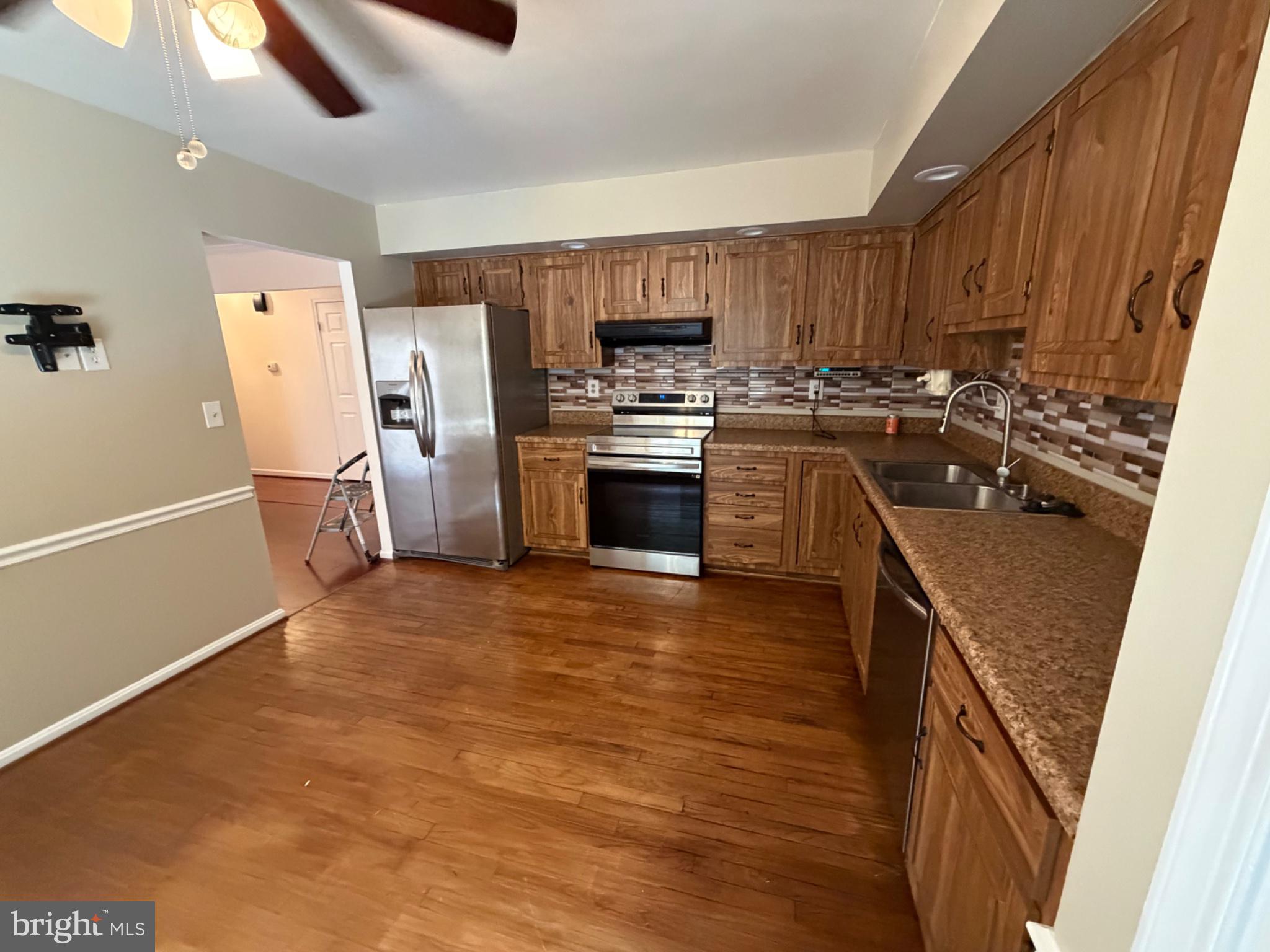 2861 Ridge Road Waldorf, MD 20603 - Photo 28 of 49 Modern kitchen with warm wood accents.