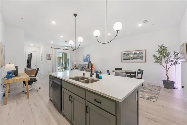 a kitchen with a table and chairs