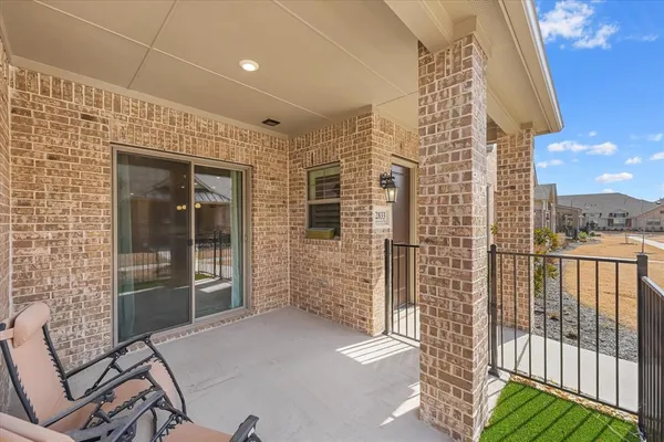 an aerial view of a house with a swimming pool