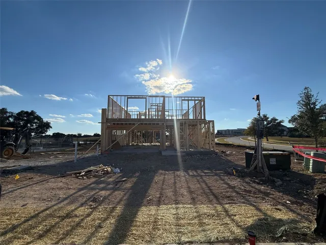 a view of a dining room with a table and chairs