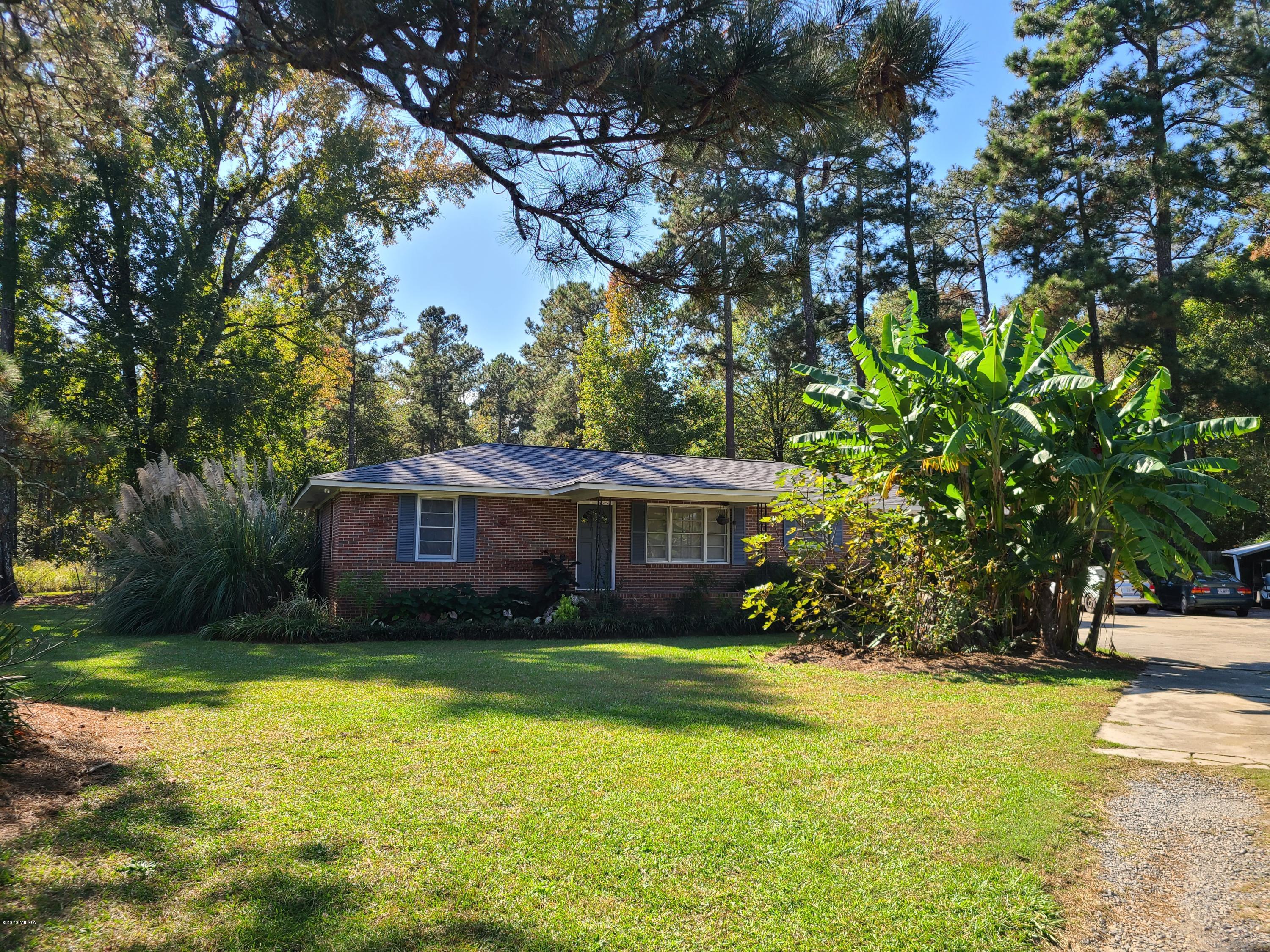 1172 Cumslo Road Macon, GA 31211 - Photo 2 of 33 a front view of house with yard and trees