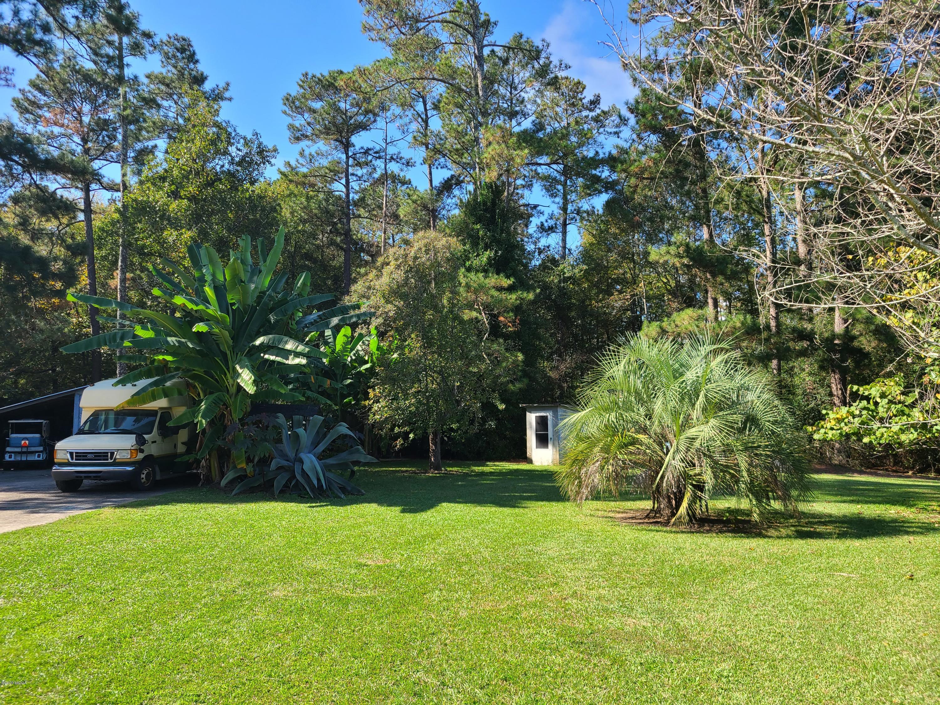 1172 Cumslo Road Macon, GA 31211 - Photo 13 of 33 a view of a garden with large trees