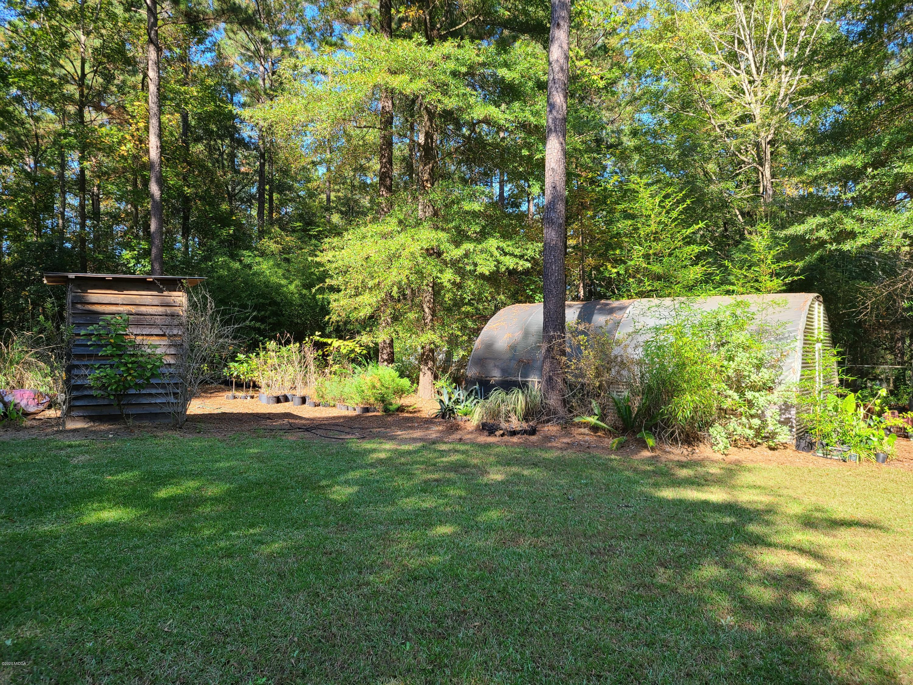 1172 Cumslo Road Macon, GA 31211 - Photo 19 of 33 a view of a backyard with a garden