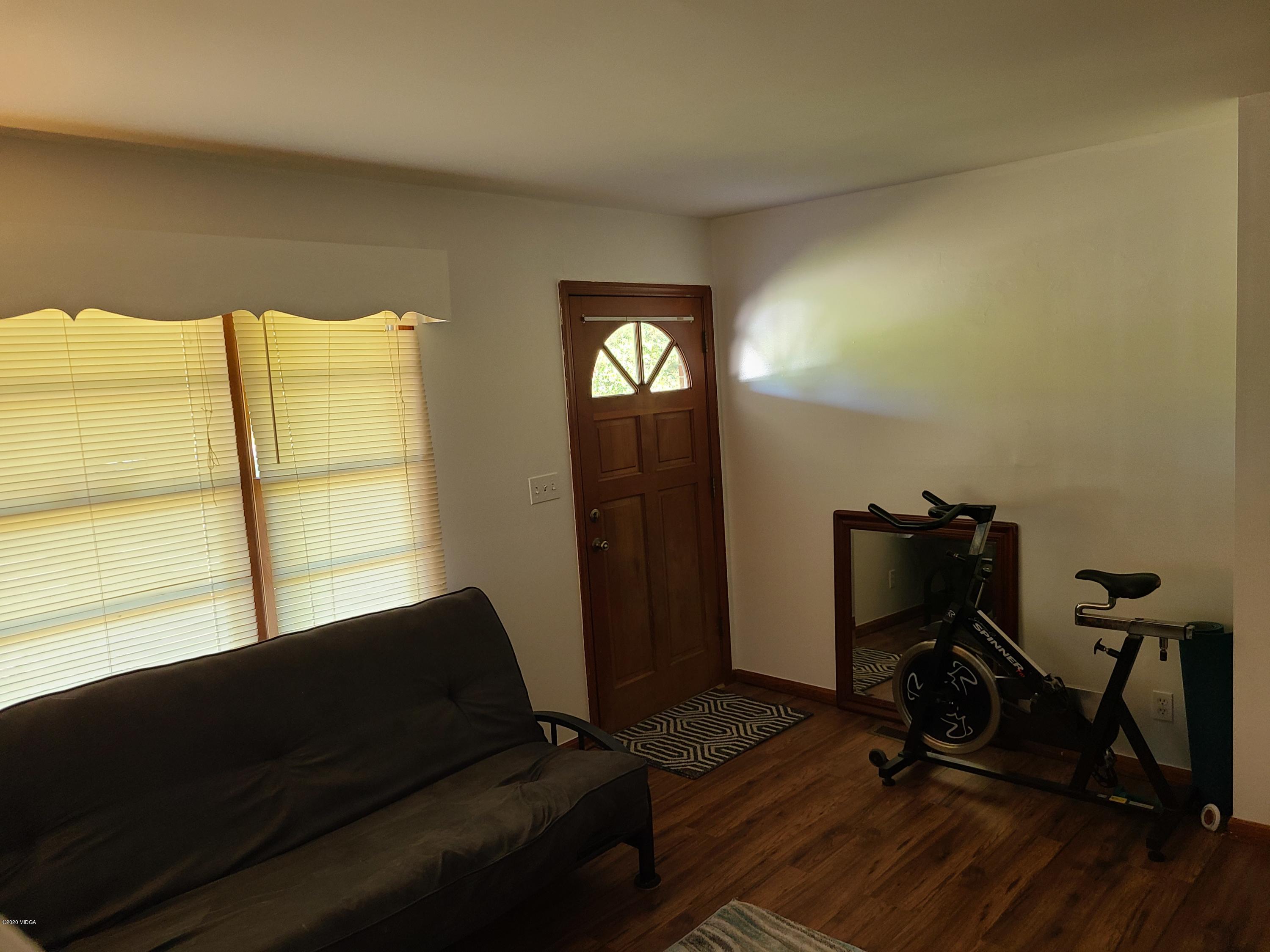 1172 Cumslo Road Macon, GA 31211 - Photo 29 of 33 a view of workspace with wooden floor and windows