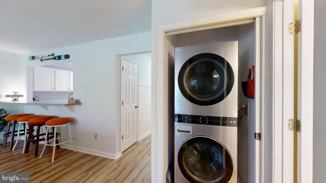 a view of a hallway with washer and dryer