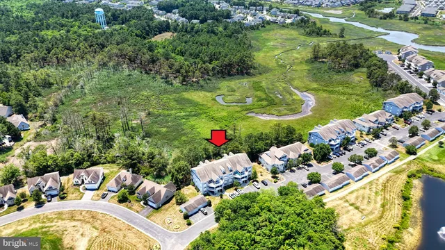an aerial view of house with yard swimming pool and outdoor seating