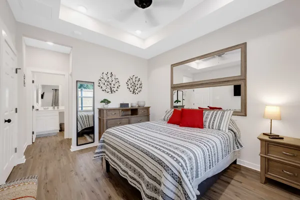 a bedroom with a bed and a lamp