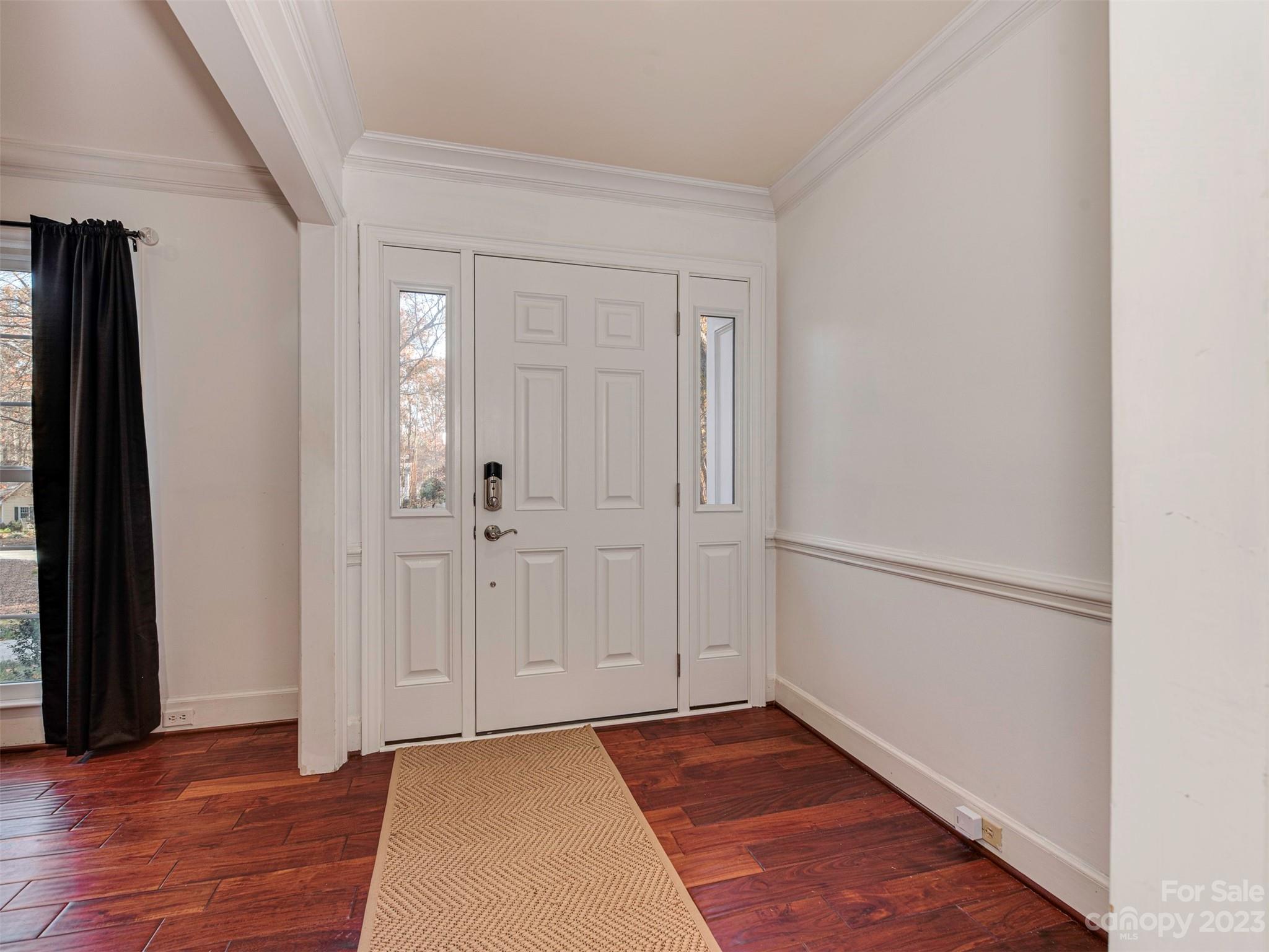 3101 High Ridge Road Charlotte, NC 28270 - Photo 3 of 45 a view of an empty room with wooden floor and a window