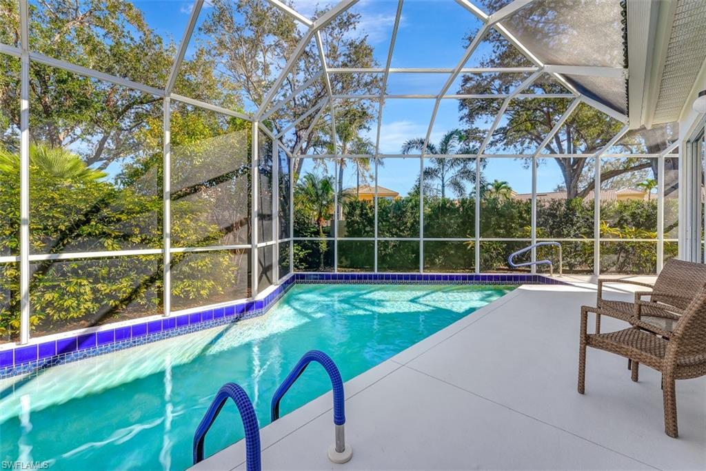 159 San Rafael Lane Naples, FL 34119 - Photo 16 of 20 a view of swimming pool with sitting area