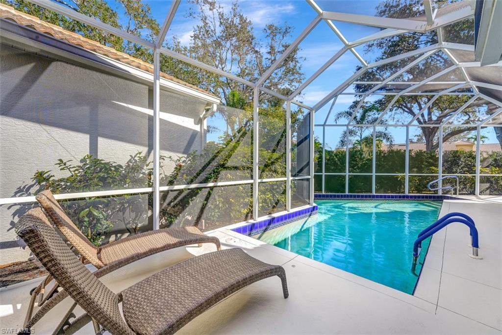 159 San Rafael Lane Naples, FL 34119 - Photo 18 of 20 a view of swimming pool with a lounge chair