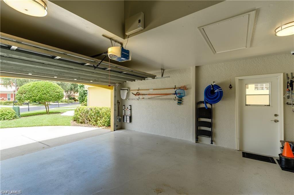 159 San Rafael Lane Naples, FL 34119 - Photo 20 of 20 a view of empty room with wooden floor and windows