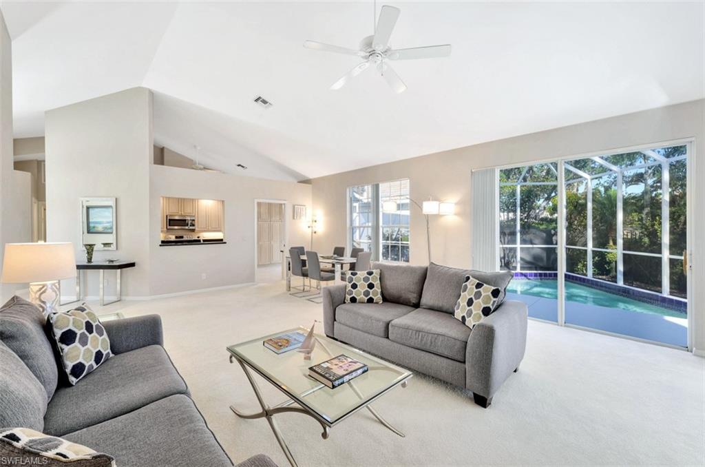 159 San Rafael Lane Naples, FL 34119 - Photo 4 of 20 a living room with furniture and a large window