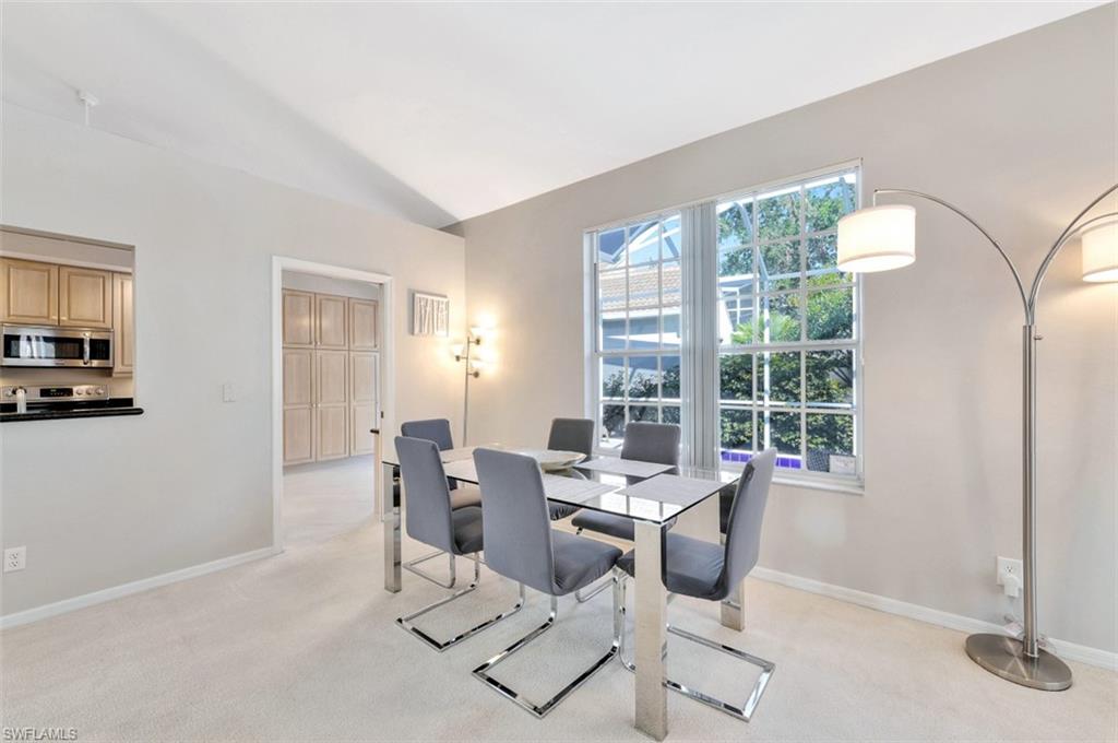 159 San Rafael Lane Naples, FL 34119 - Photo 5 of 20 a dining room with furniture and window