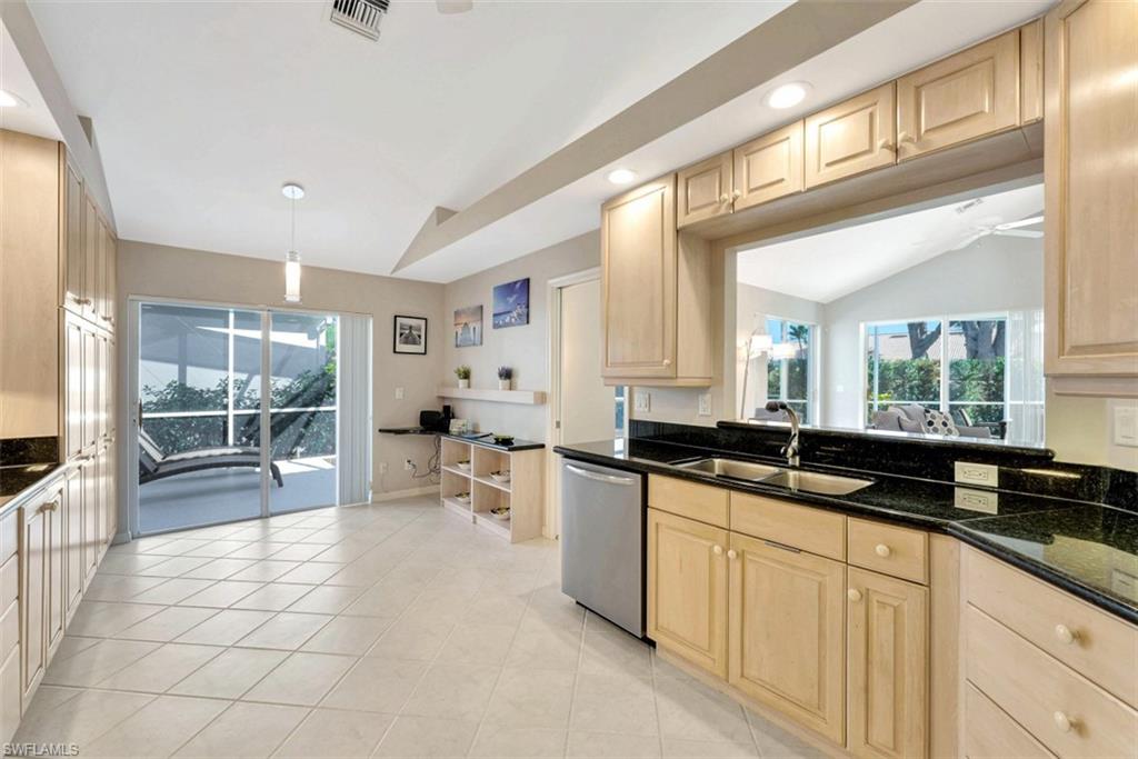 159 San Rafael Lane Naples, FL 34119 - Photo 8 of 20 a large white kitchen with a large window