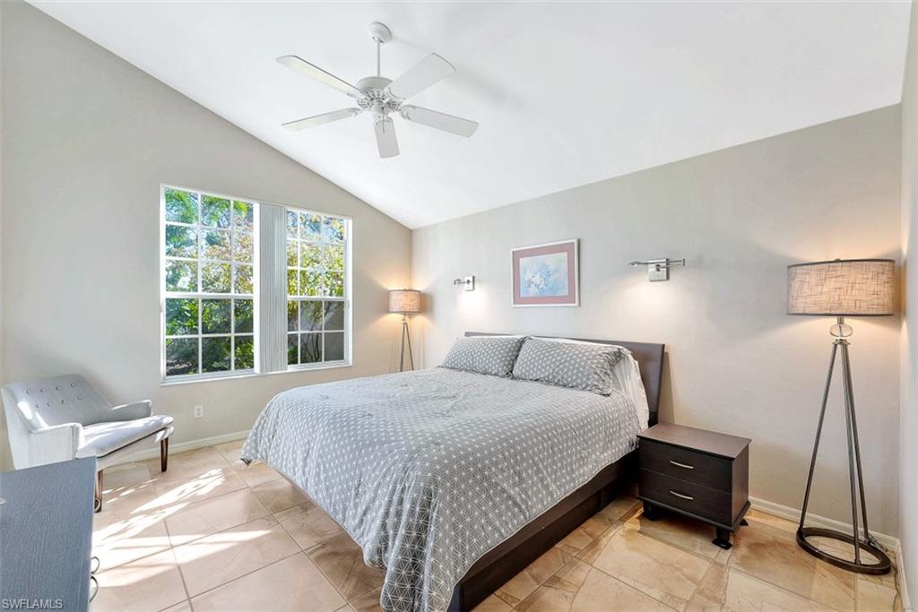 159 San Rafael Lane Naples, FL 34119 - Photo 9 of 20 a bedroom with a bed and a window