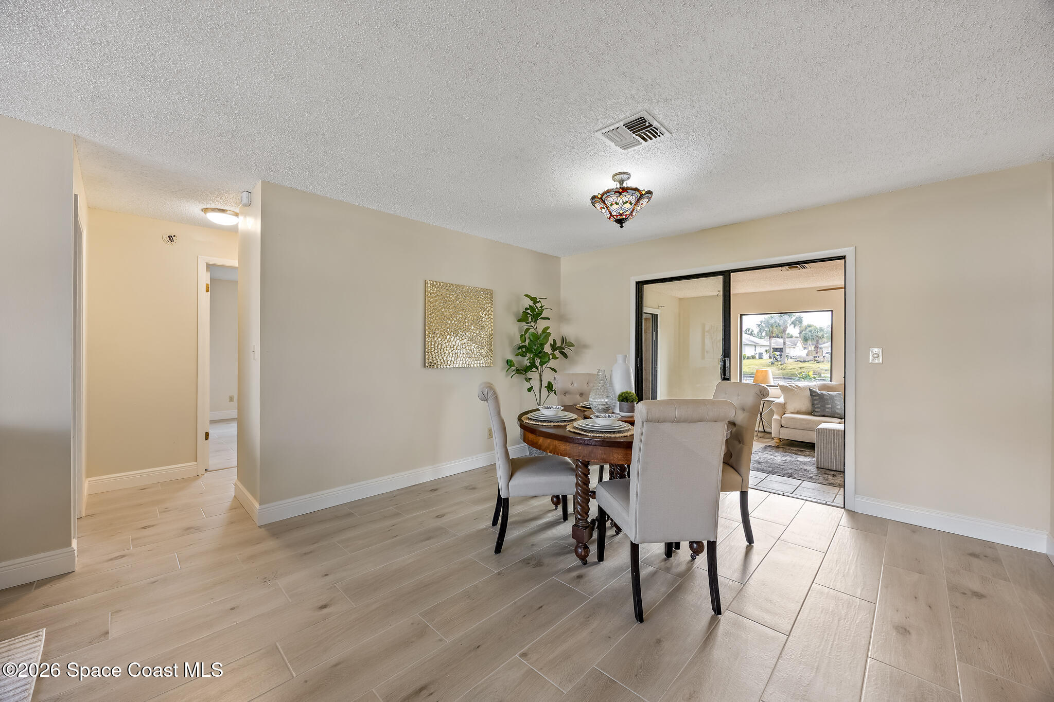 180 Concha Drive Sebastian, FL 32958 - Photo 12 of 32 a view of a dining room with furniture window and wooden floor