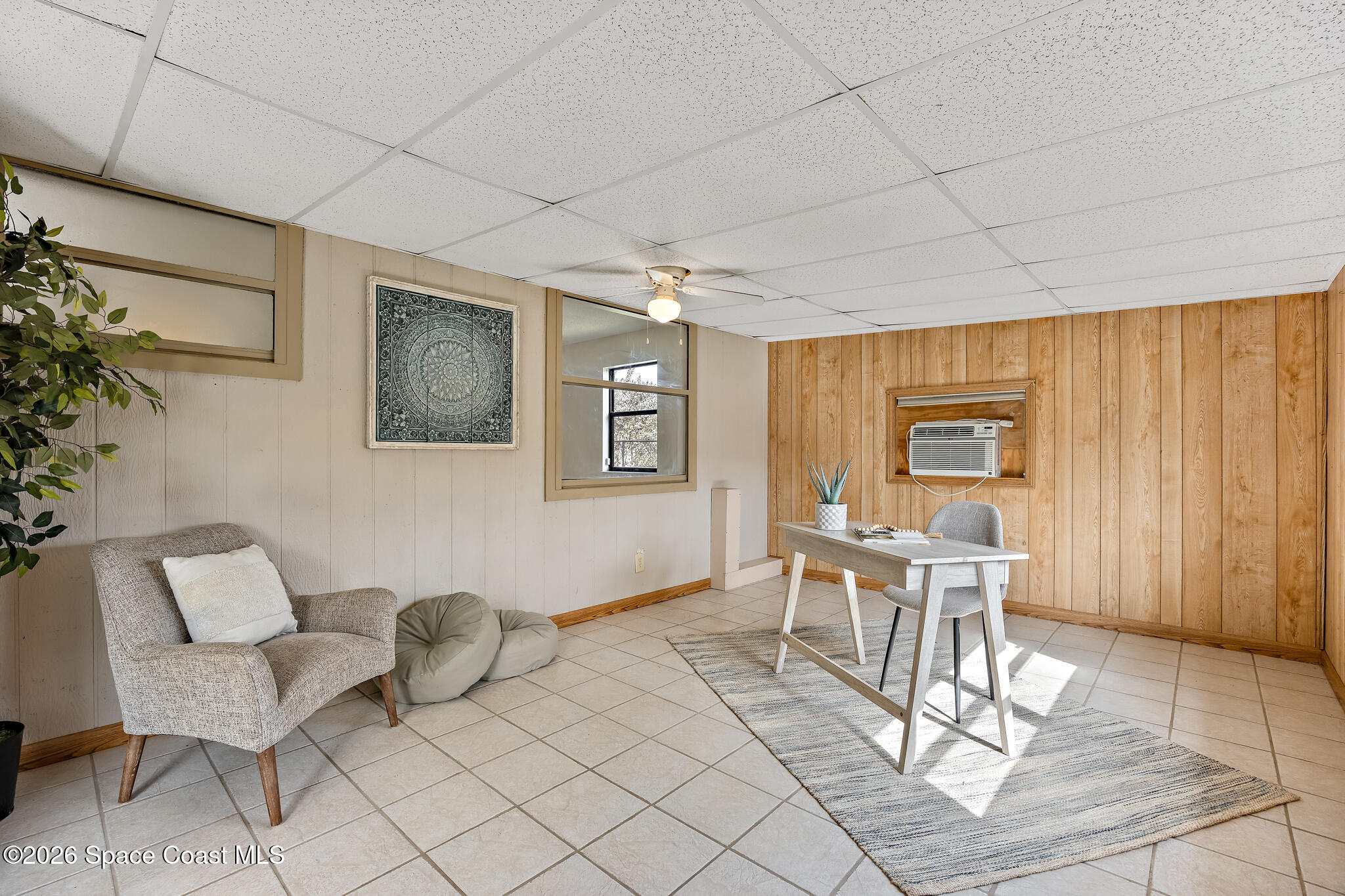 180 Concha Drive Sebastian, FL 32958 - Photo 13 of 32 a living room with furniture a dining table and a painting on the wall