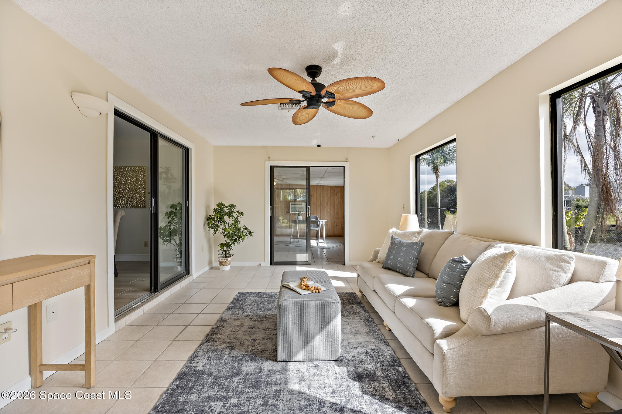 180 Concha Drive Sebastian, FL 32958 - Photo 15 of 32 a living room with furniture and a chandelier