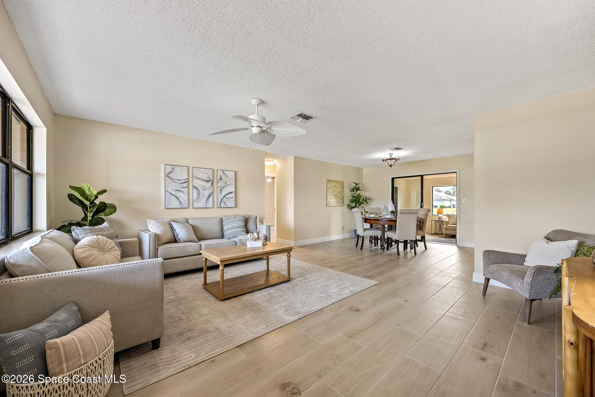 180 Concha Drive Sebastian, FL 32958 - Photo 23 of 32 a living room with furniture and wooden floor
