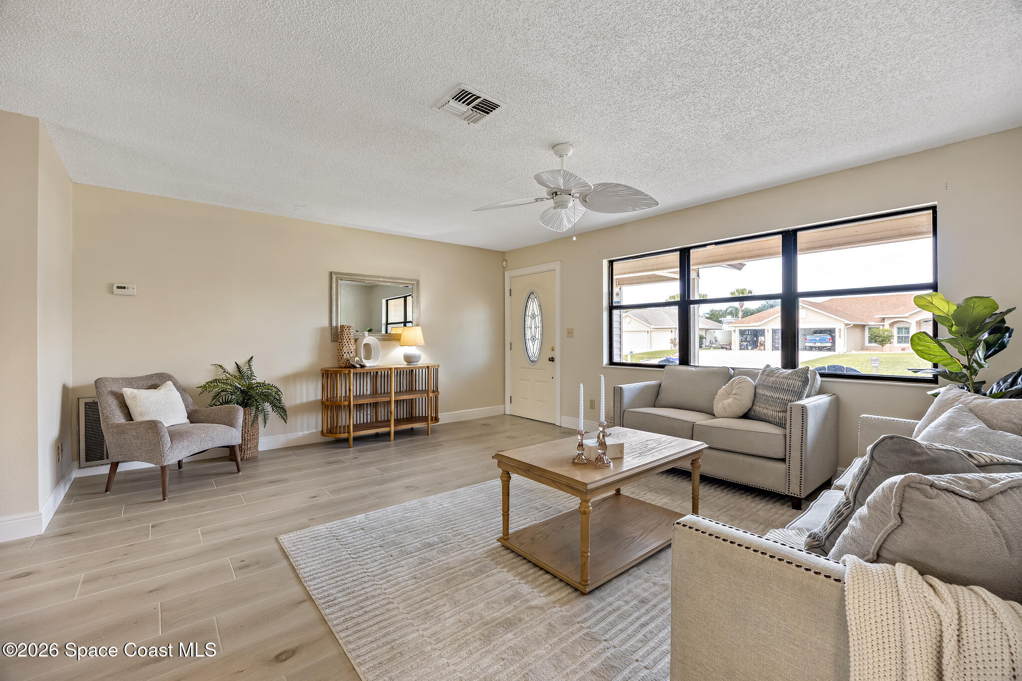 180 Concha Drive Sebastian, FL 32958 - Photo 30 of 32 a living room with furniture and a window