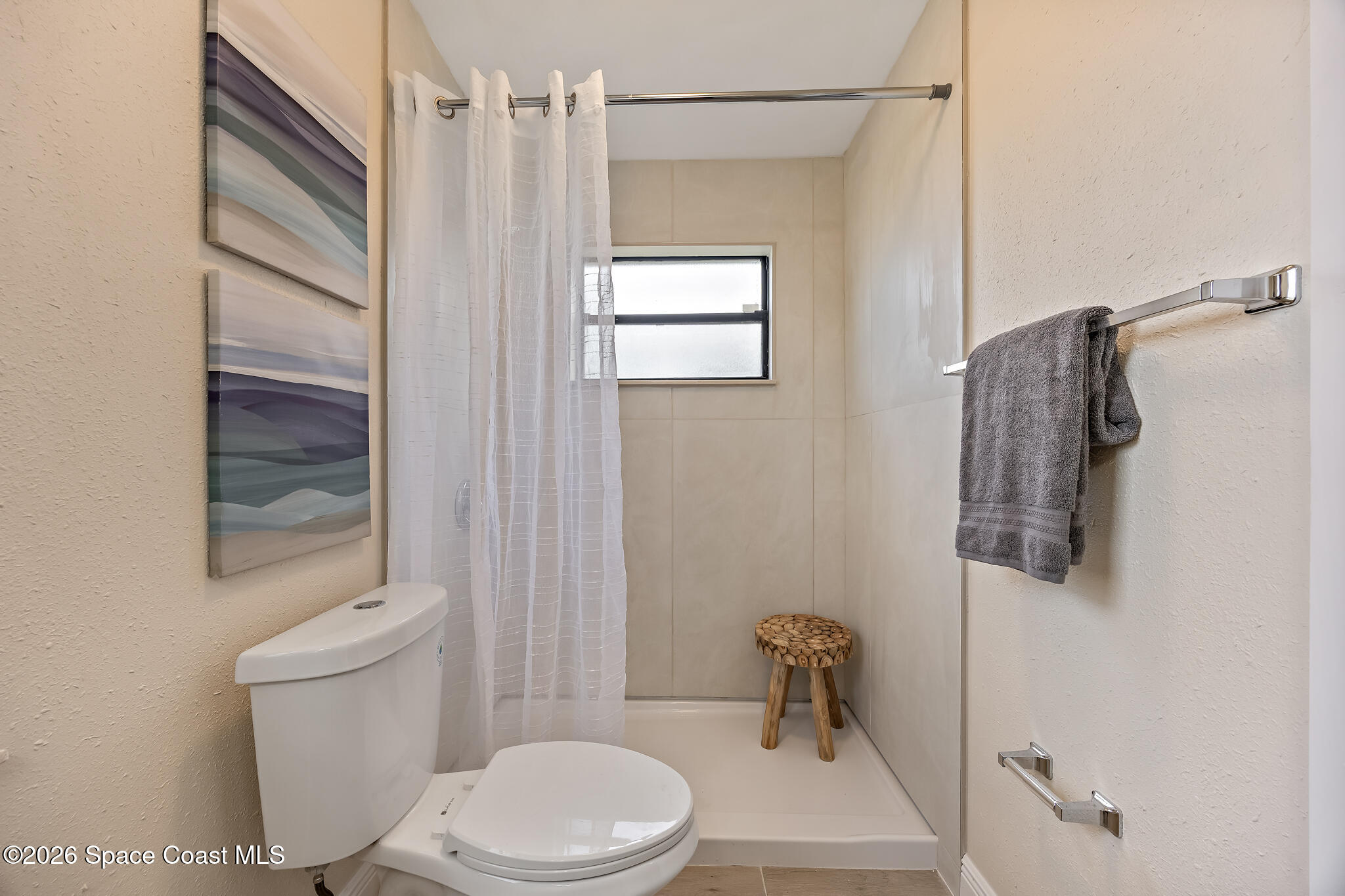 180 Concha Drive Sebastian, FL 32958 - Photo 3 of 32 a bathroom with a toilet a sink and shower