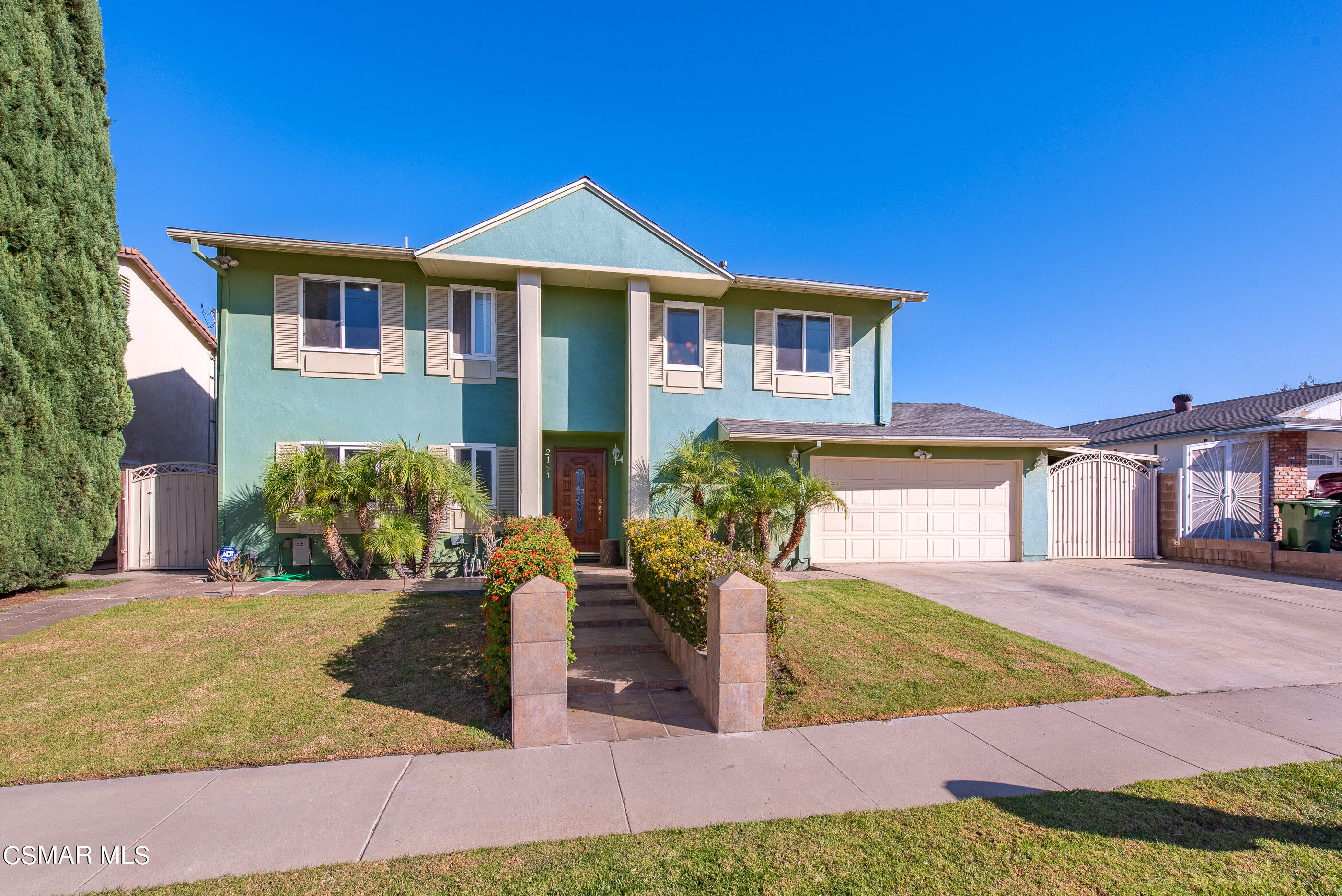 2181 Rhoda Street Simi Valley, CA 93065 - Photo 1 of 36 a front view of a house with garden