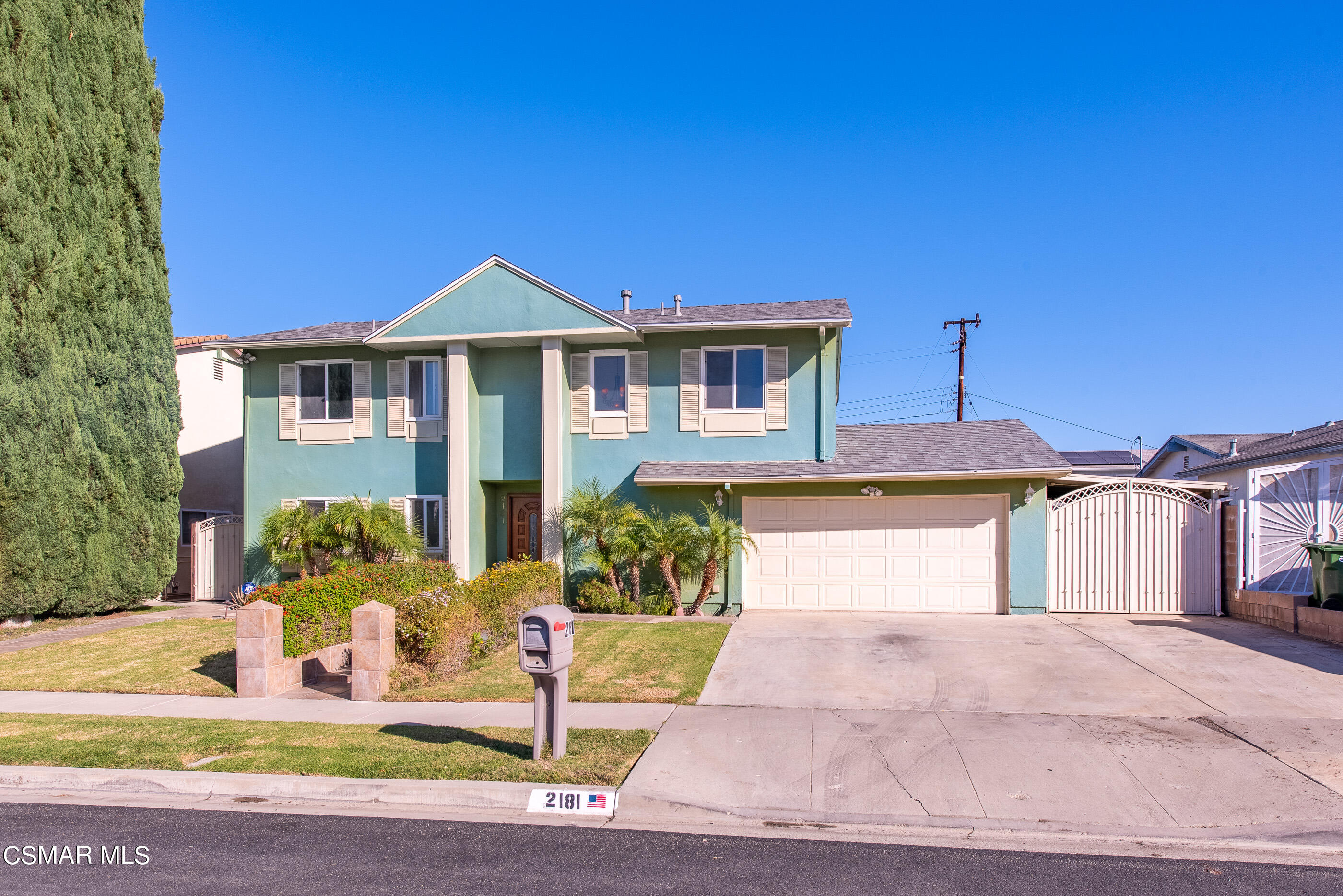 2181 Rhoda Street Simi Valley, CA 93065 - Photo 2 of 36 a front view of a house with a yard