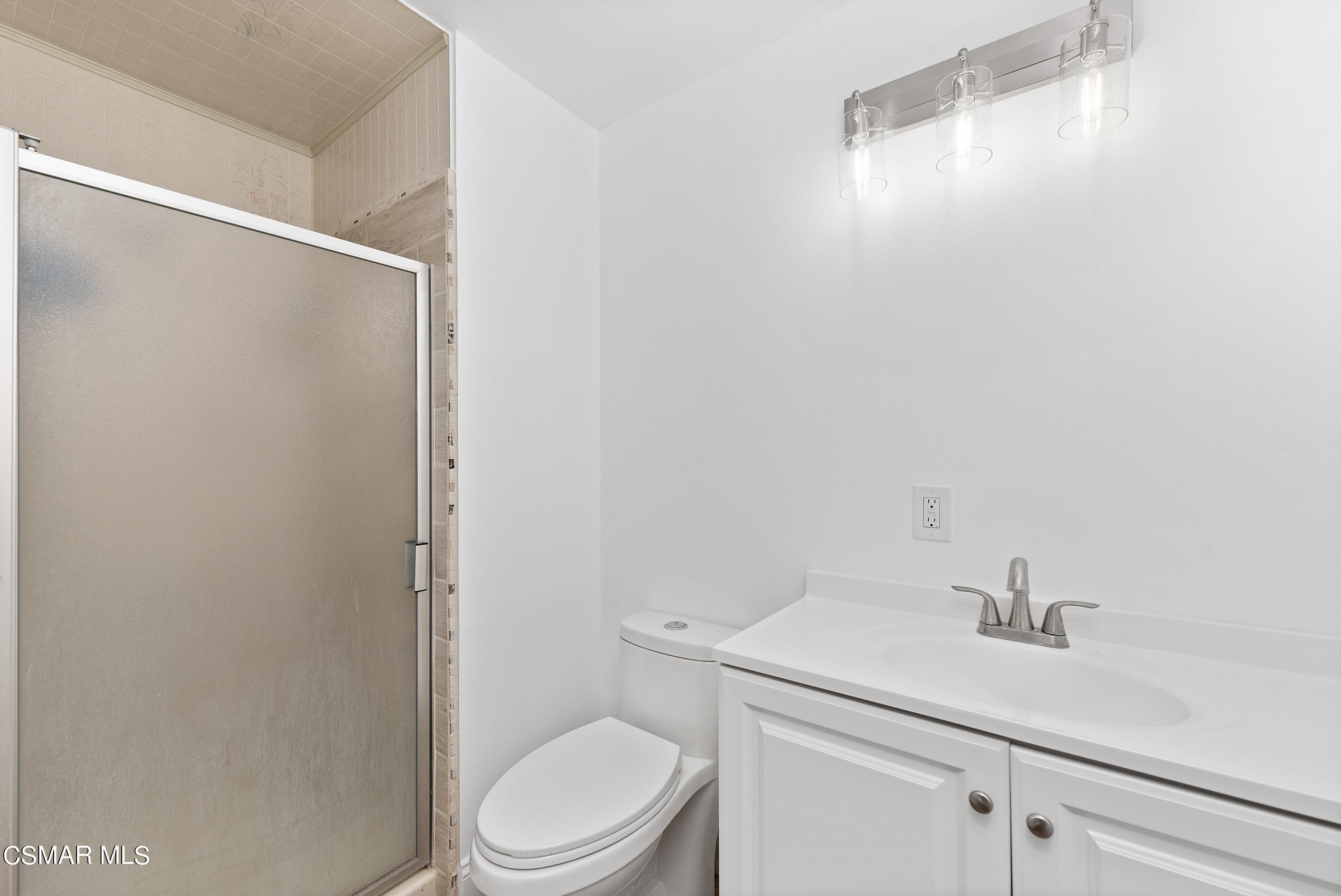 2181 Rhoda Street Simi Valley, CA 93065 - Photo 20 of 36 a bathroom with a sink a toilet and vanity