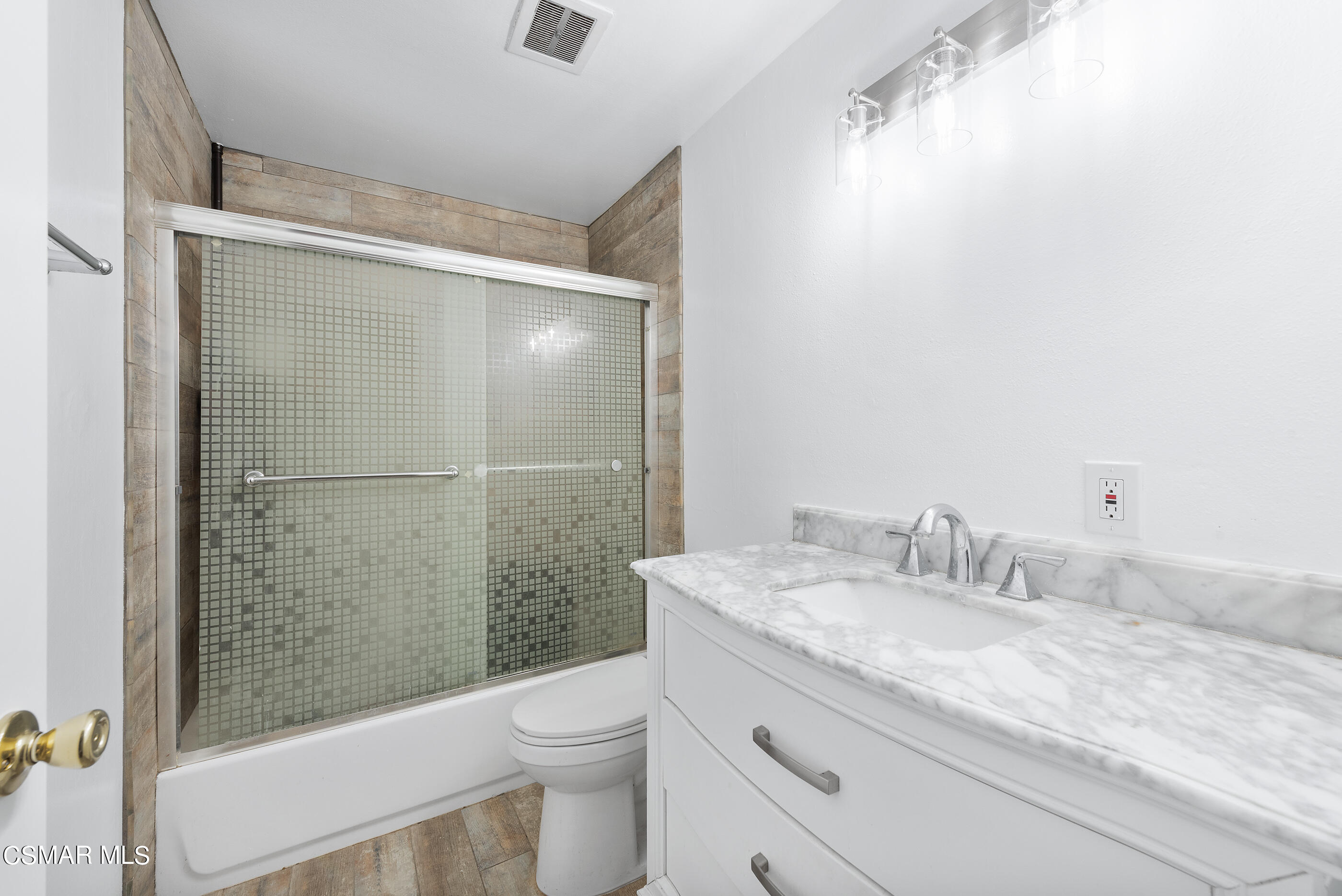 2181 Rhoda Street Simi Valley, CA 93065 - Photo 24 of 36 a bathroom with a granite countertop sink toilet and shower