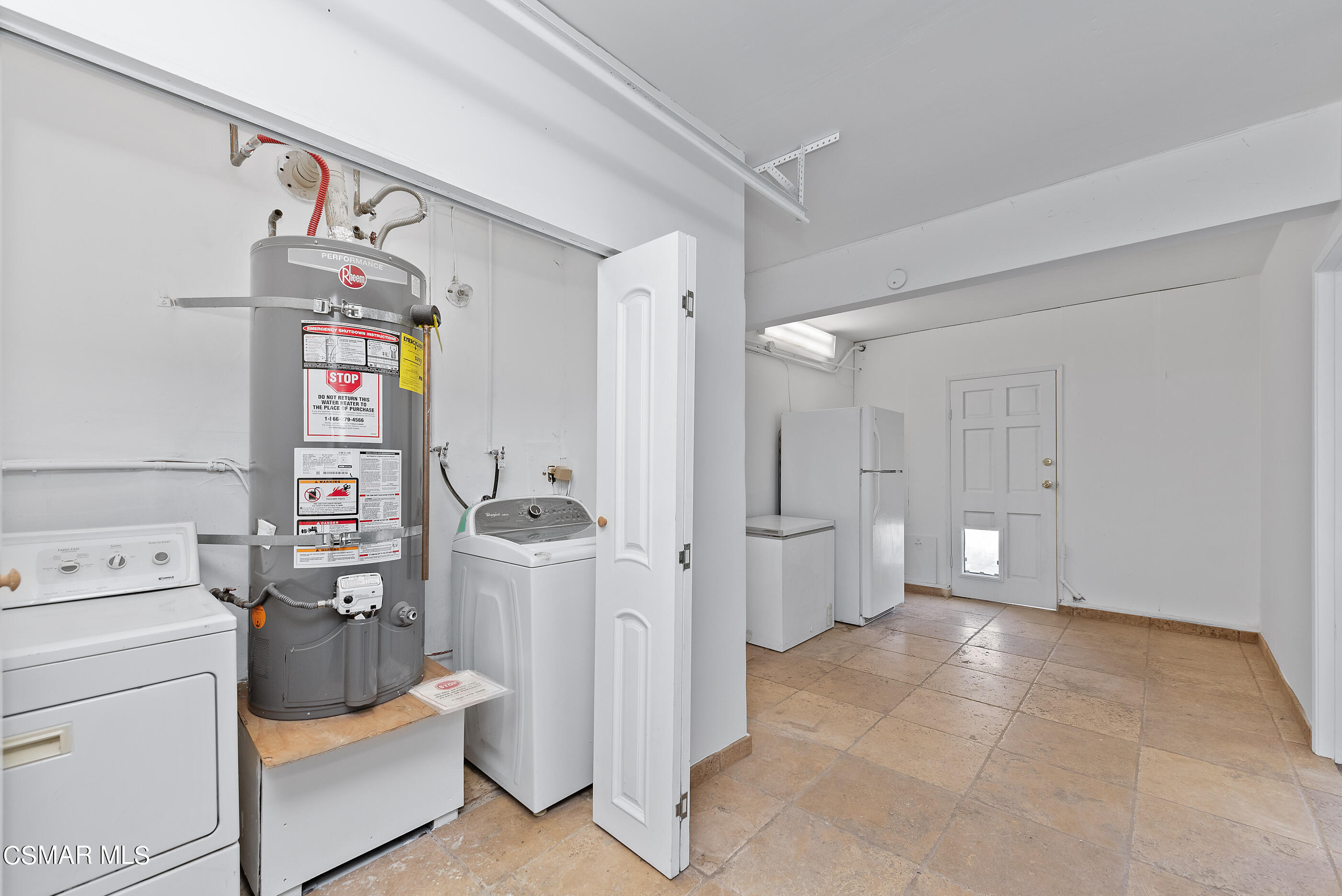 2181 Rhoda Street Simi Valley, CA 93065 - Photo 26 of 36 a view of a storage & utility room with fridge washer and dryer