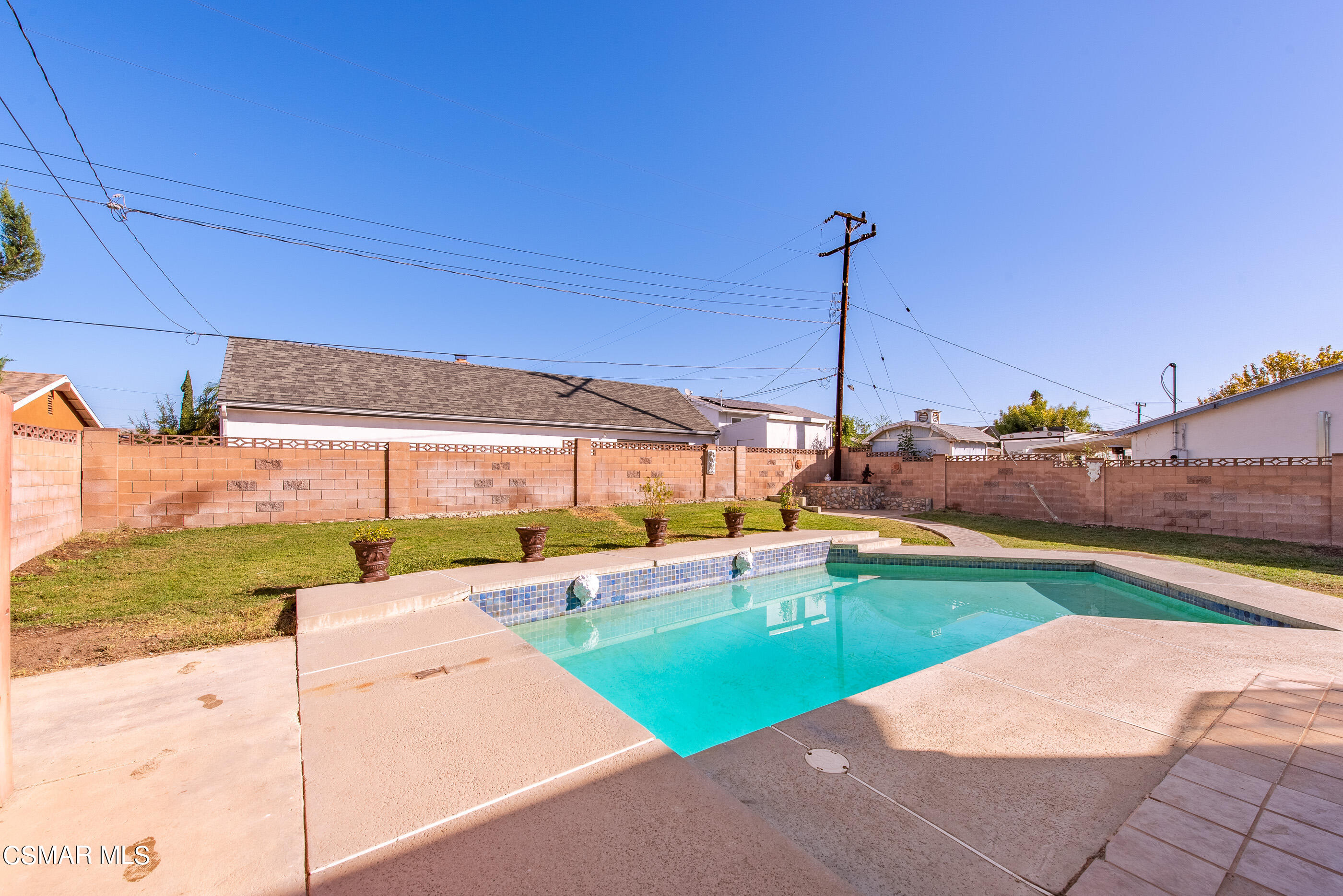 2181 Rhoda Street Simi Valley, CA 93065 - Photo 28 of 36 a view of a swimming pool with a yard