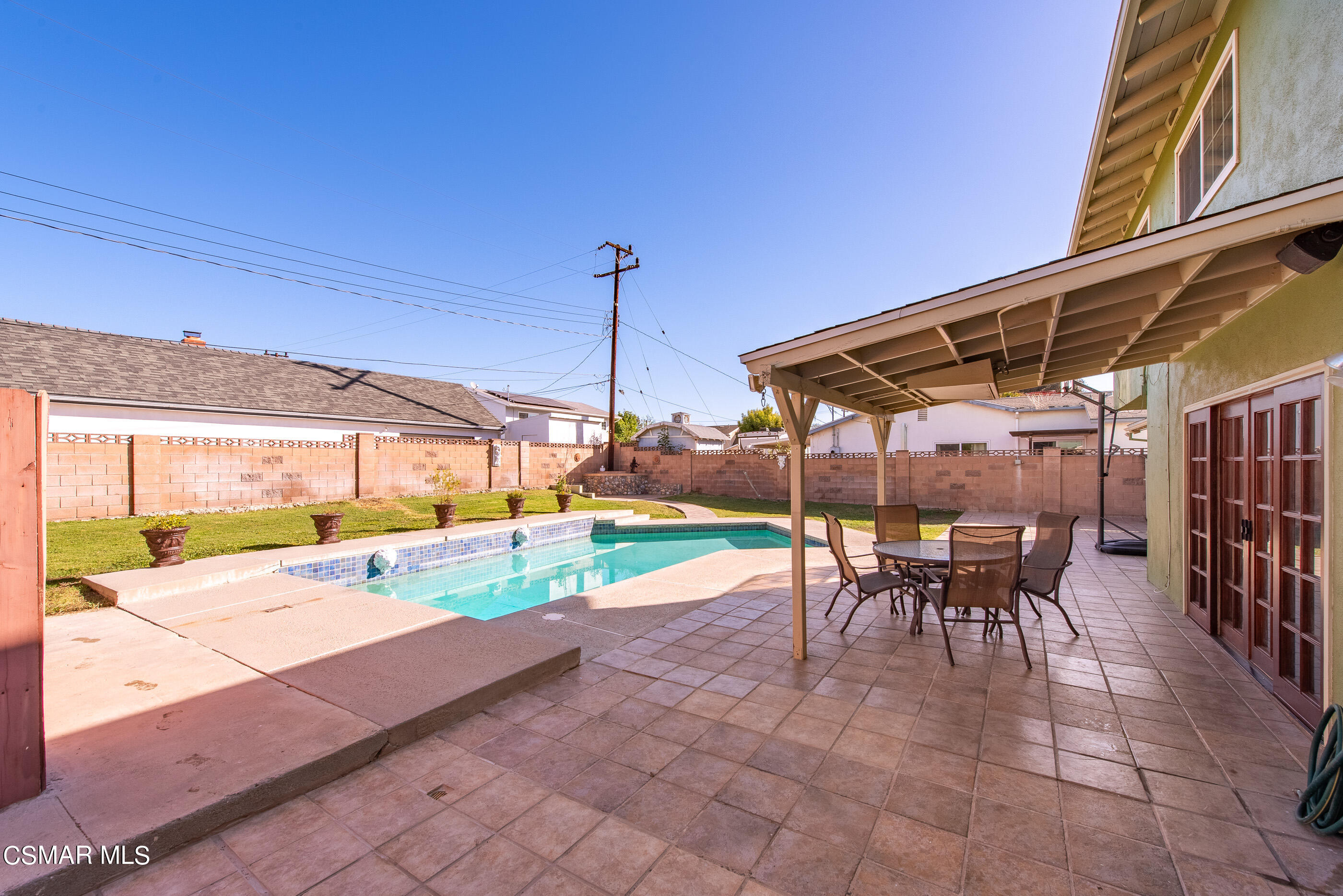 2181 Rhoda Street Simi Valley, CA 93065 - Photo 29 of 36 a view of a patio with a table and chairs