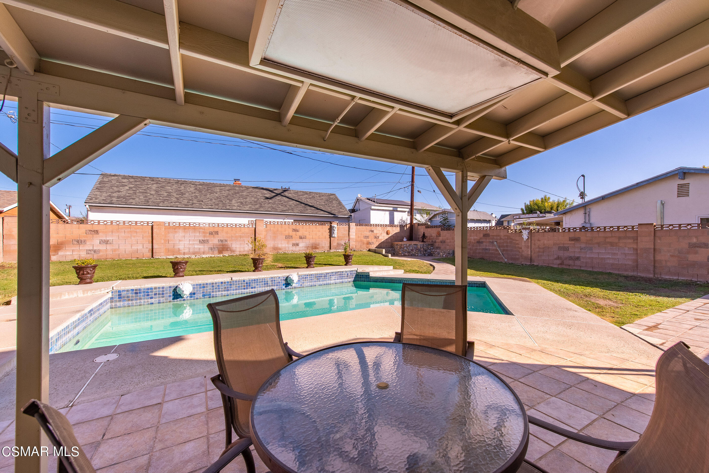 2181 Rhoda Street Simi Valley, CA 93065 - Photo 30 of 36 a view of a swimming pool with a chairs in a patio