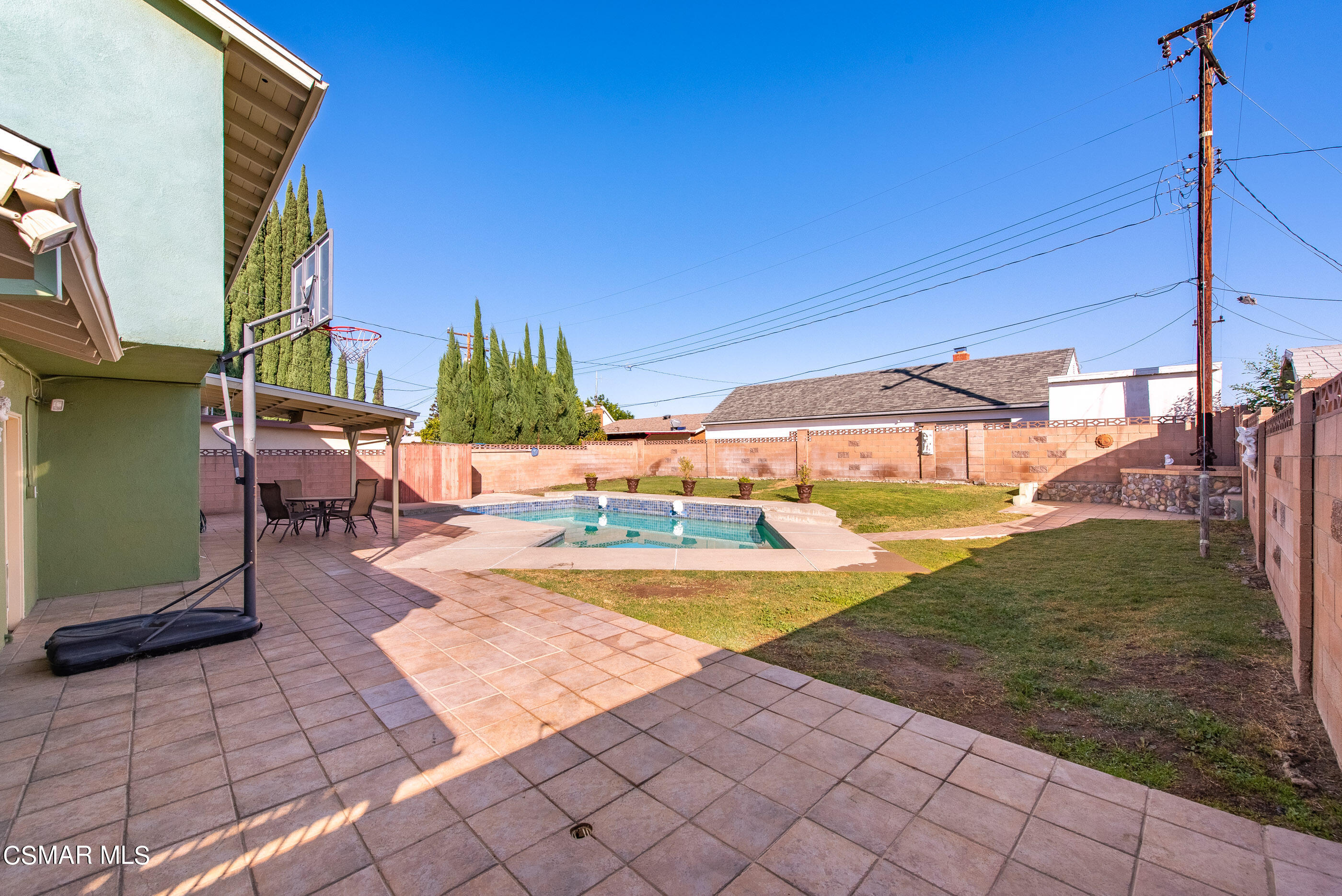 2181 Rhoda Street Simi Valley, CA 93065 - Photo 31 of 36 a view of a swimming pool with a yard