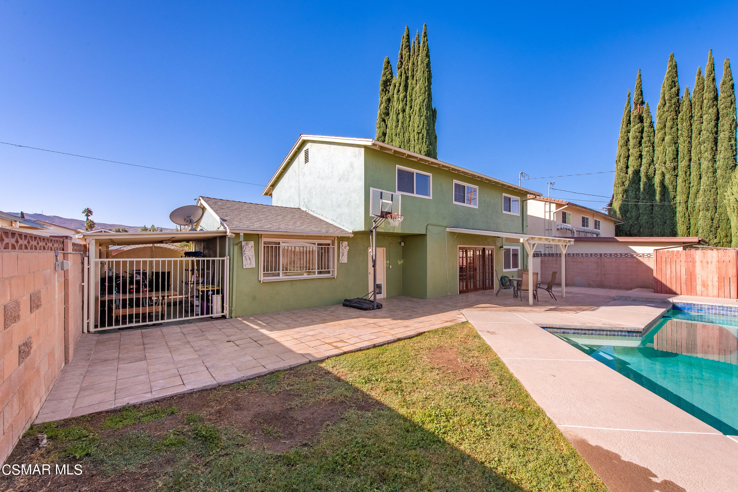 2181 Rhoda Street Simi Valley, CA 93065 - Photo 32 of 36 a front view of a house with a yard and potted plants