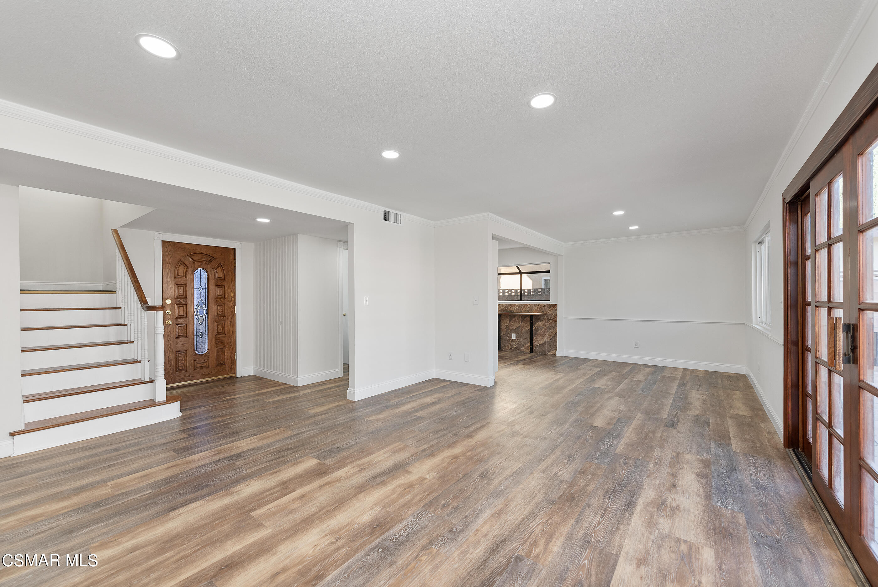 2181 Rhoda Street Simi Valley, CA 93065 - Photo 6 of 36 a view of empty room with wooden floor and stairs