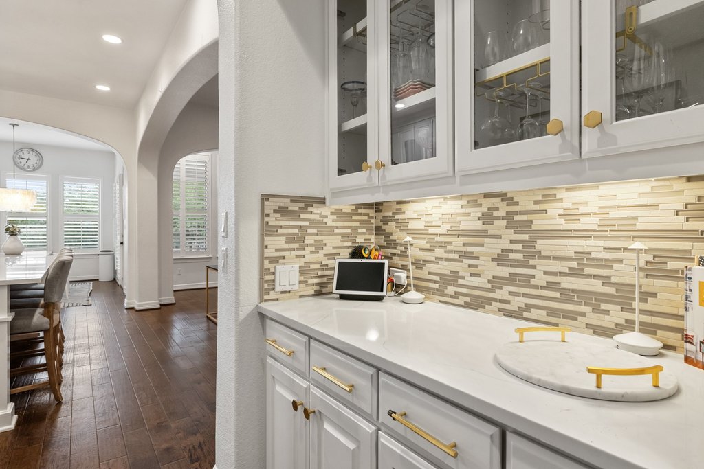 8801 Wild Rice Cove Austin, TX 78738 - Photo 16 of 40 a kitchen with a sink and a refrigerator