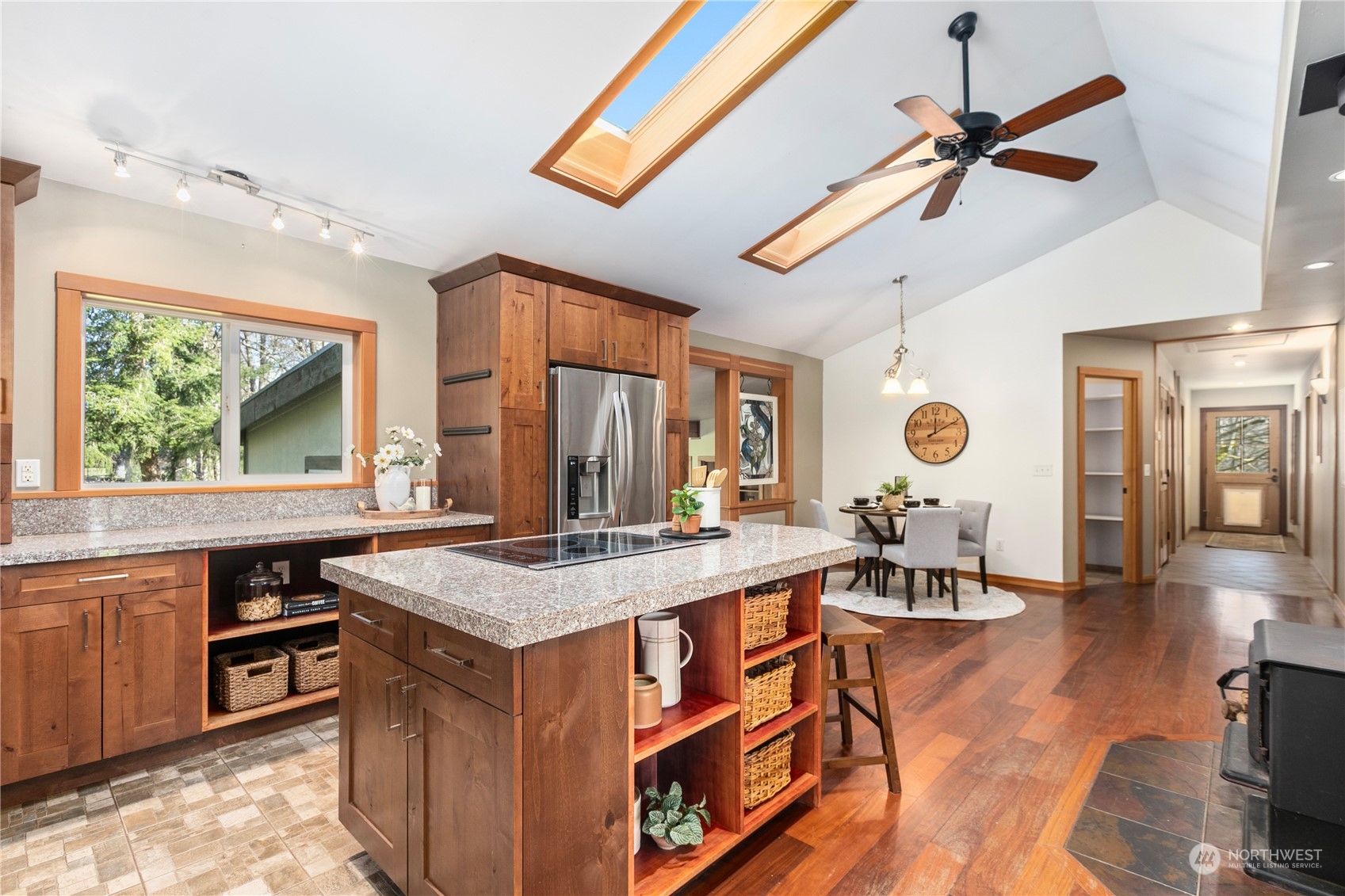 3193 Behme Road Custer, WA 98240 - Photo 5 of 33 a view of a kitchen counter top space with furniture and wooden floor