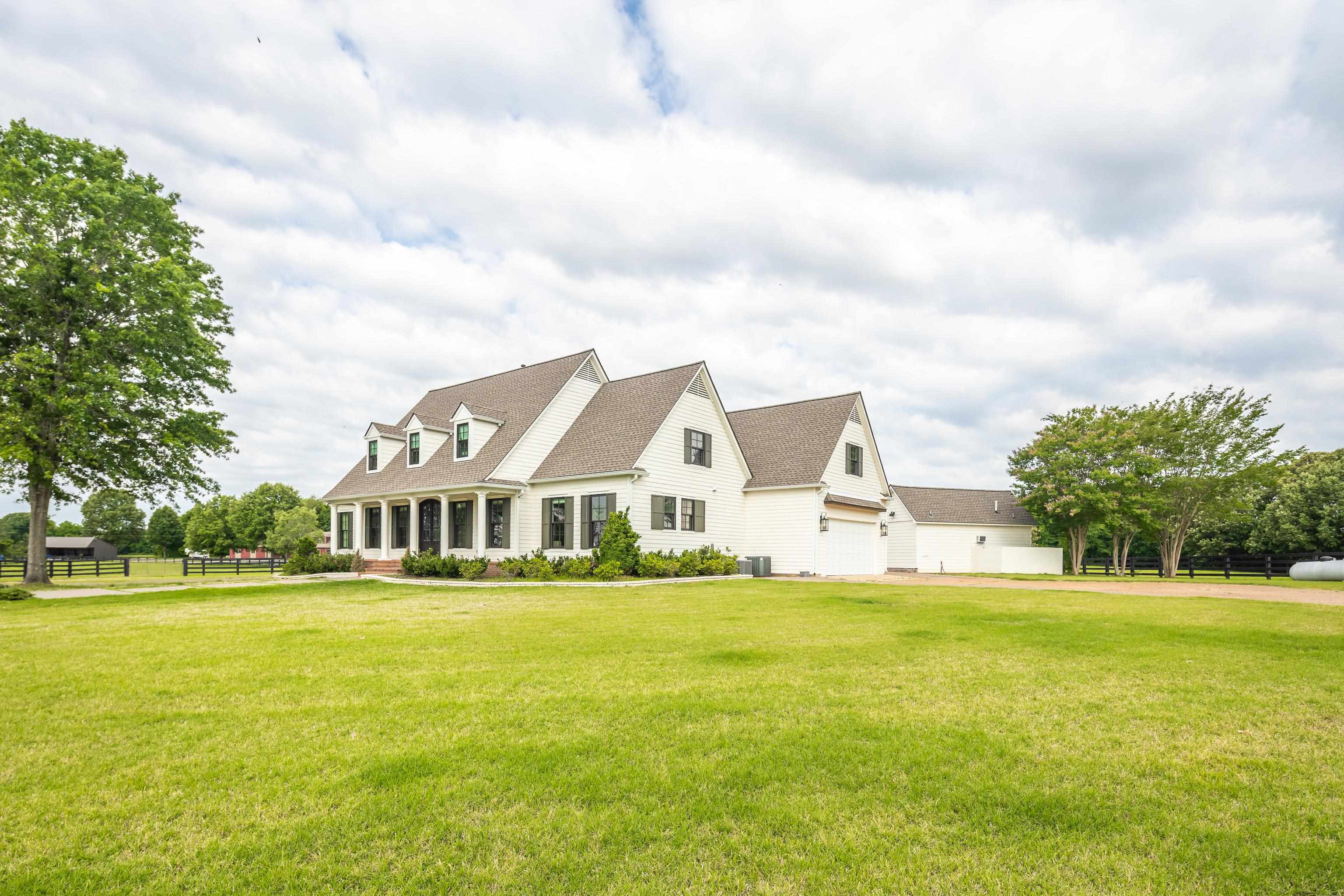 6085 Yum Yum Road Somerville, TN 38068 - Photo 8 of 40 a view of a house with a big yard and large trees