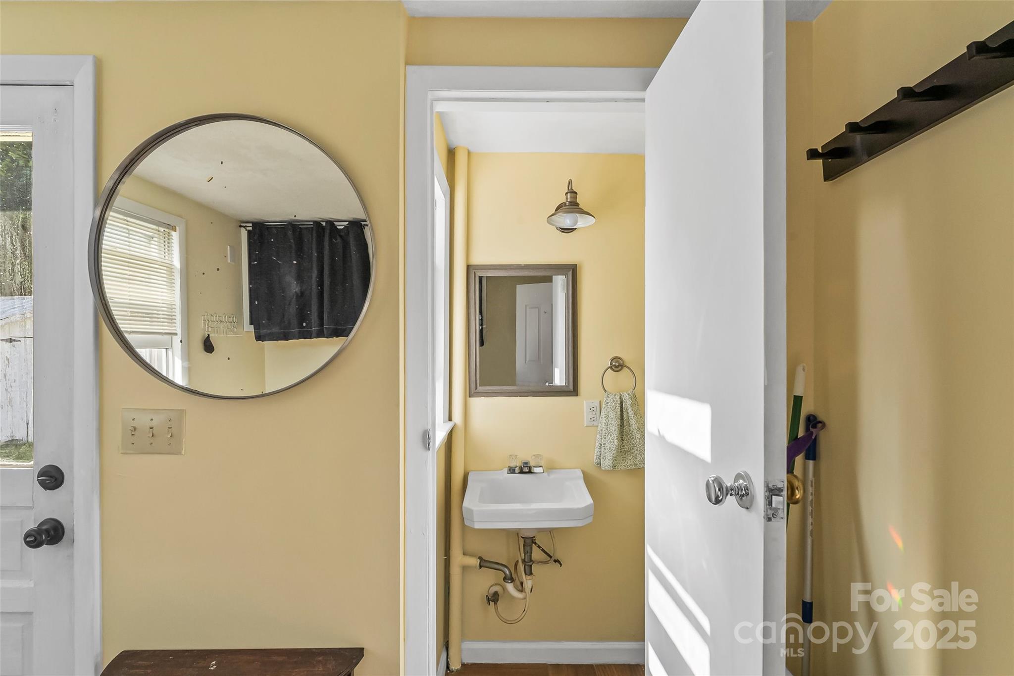 70 1st Street Canton, NC 28716 - Photo 21 of 34 a bathroom with a sink mirror and vanity