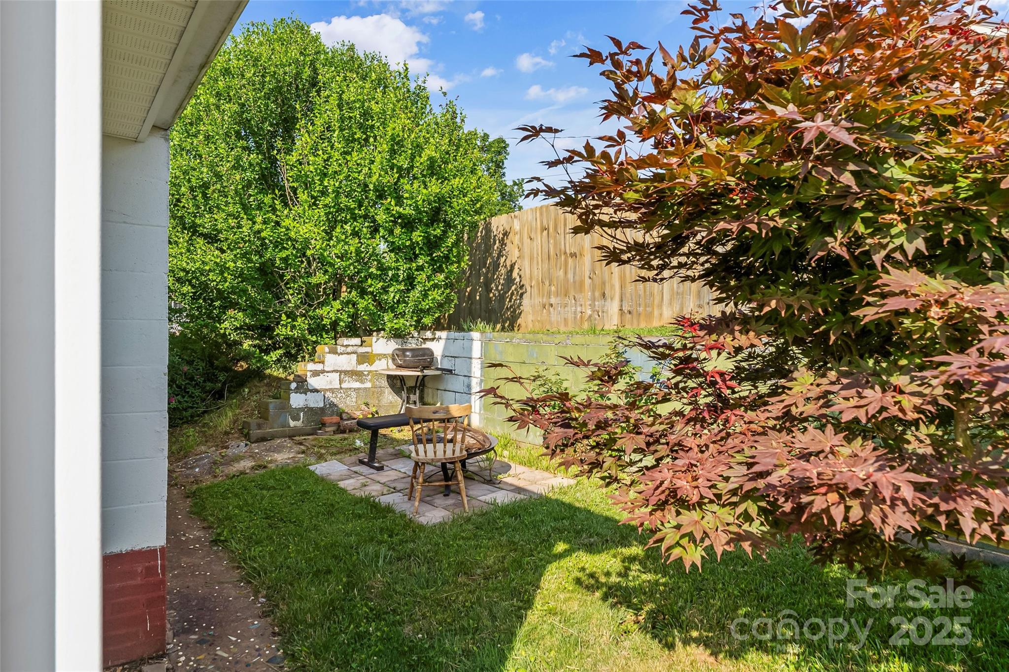 70 1st Street Canton, NC 28716 - Photo 29 of 34 a view of a backyard with sitting area