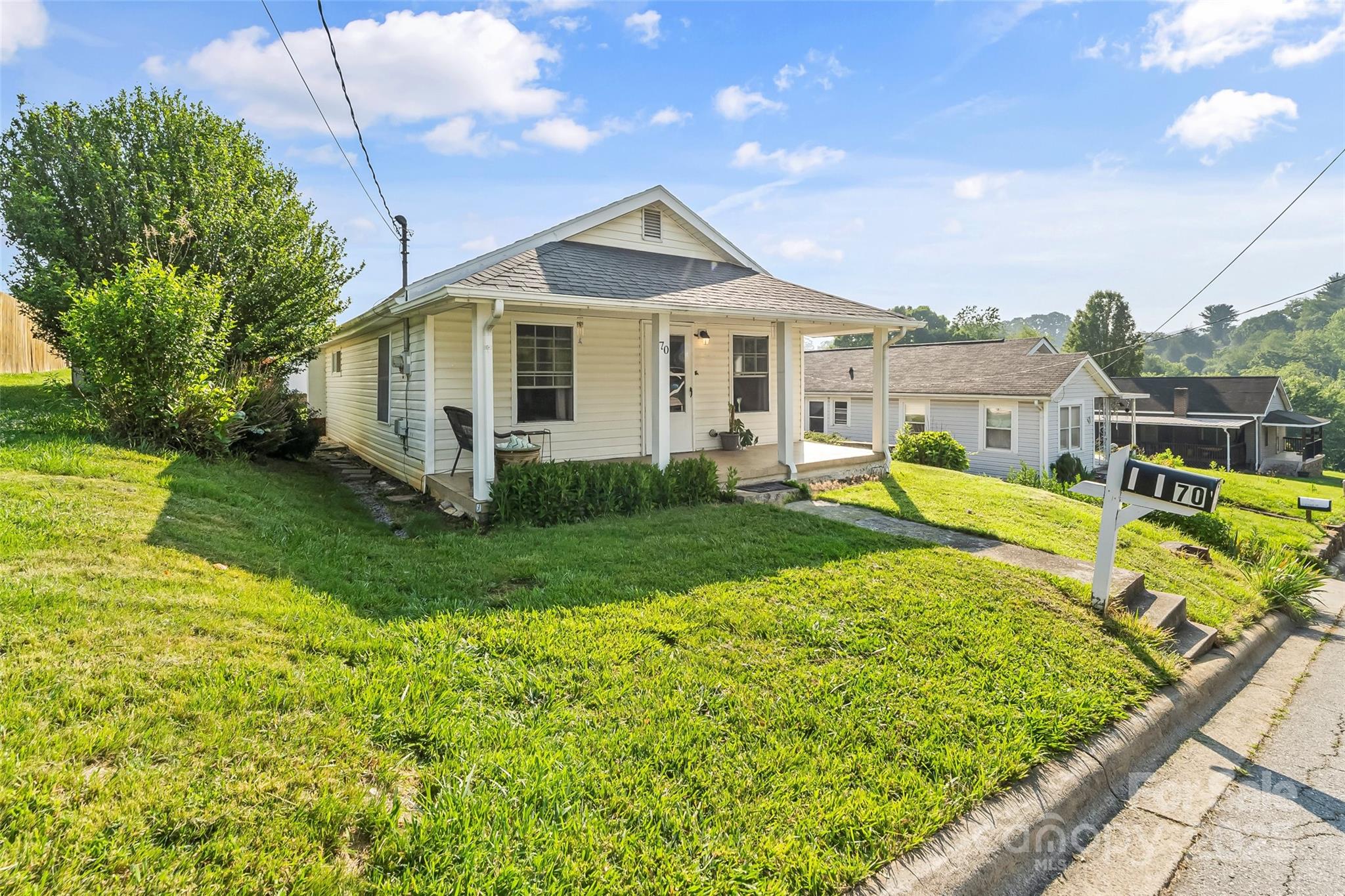 70 1st Street Canton, NC 28716 - Photo 3 of 34 a front view of a house with garden