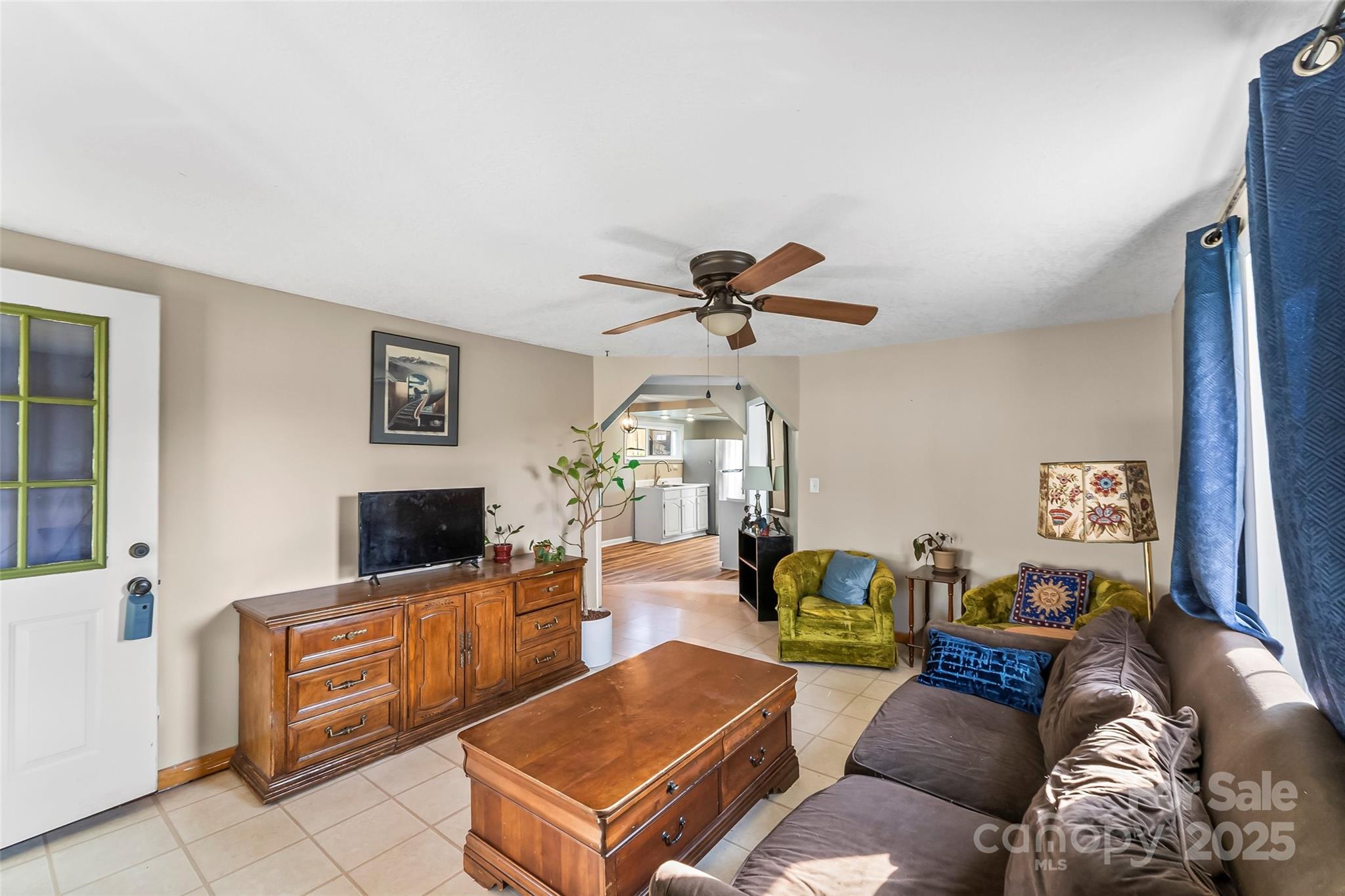 70 1st Street Canton, NC 28716 - Photo 7 of 34 a living room with furniture and a flat screen tv